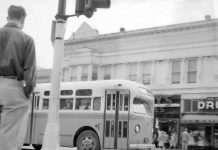 A city bus rolls along Main Street into the Watsonville Transit Square on March 23, 1954.
