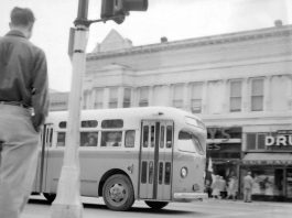 A city bus rolls along Main Street into the Watsonville Transit Square on March 23, 1954.