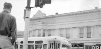 A city bus rolls along Main Street into the Watsonville Transit Square on March 23, 1954.