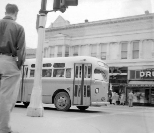 A city bus rolls along Main Street into the Watsonville Transit Square on March 23, 1954.