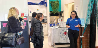 Sofia Ramirez leads a tour Monday of the new Wellness Center and Food Pantry at the Watsonville Cabrillo College Center.
