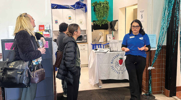 Sofia Ramirez leads a tour Monday of the new Wellness Center and Food Pantry at the Watsonville Cabrillo College Center.