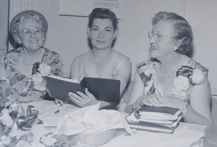 These women enjoy an evening with the Grandmother's Club in April of 1957.