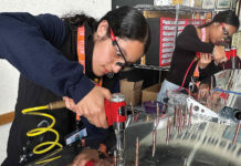 Pajaro Valley High students taking flight RIVETING Valeria Melgoza-Ortiz inserts rivets into the tail section of an Van’s RV-12 two-seat airplane.