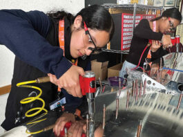 RIVETING Valeria Melgoza-Ortiz inserts rivets into the tail section of an Van’s RV-12 two-seat airplane.