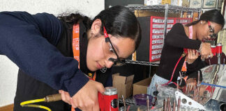 RIVETING Valeria Melgoza-Ortiz inserts rivets into the tail section of an Van’s RV-12 two-seat airplane.
