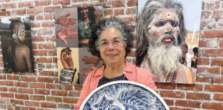 Exhibit on body art comes to PV Arts Roberta Valdez shows a ceramic work by Britton McFetridge. Valdez is the curator of the current exhibit at PV Arts in Watsonville. (Tarmo Hannula/The Pajaronian)
