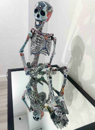 The skeleton seated on a mirror is fabric sewn together by Susan Ele titled &ldquo;Lydia the Tattooed Lady.&rdquo;. (Tarmo Hannula/The Pajaronian)
