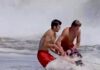 Ryder Williams and another lifeguard help rescue a 10-year-old boy from the waves at Seabright Beach on July 25. (Scott Vander Dussen/@santacruznow)