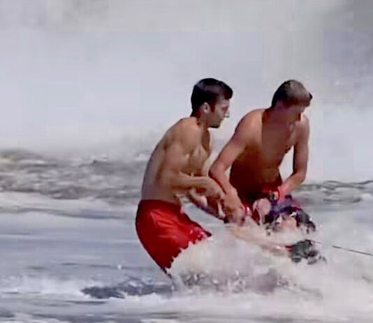 Ryder Williams and another lifeguard help rescue a 10-year-old boy from the waves at Seabright Beach on July 25. (Scott Vander Dussen/@santacruznow)