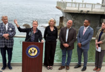 Ted Balestreri, CEO and Chairman of the Cannery Row Company, left, joins Monterey County Supervisor Supervisor Kate Daniels, at podium, along with Monterey Bay Aquarium CEO Jenny Gray, Rep. Jimmy Panetta, Monterey Mayor Tyller Williamson and Save Our Shores Executive Director Katie Thompson. (Todd Guild/The Pajaronian)
