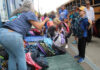 Stuff the Bus volunteers pack 2,500 backpacks for students