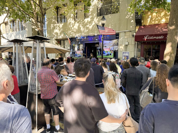 Fans watch the United States men's national team play Belgium last week on Castro Street in Mountain View.