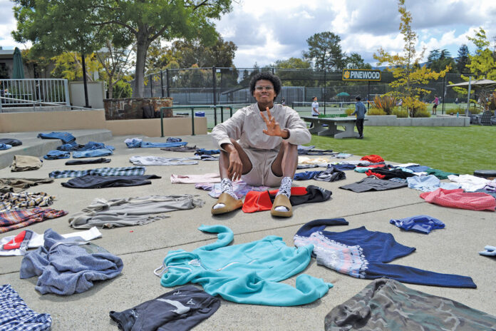 Jaden Norwood organized a clothing swap at Pinewood School in Los Altos Hills last week to encourage his classmates to take interest in sustainable fashion.